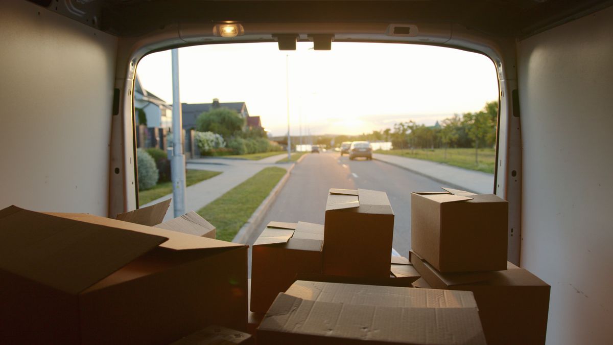 Cargo van loaded with boxes on a neighborhood route